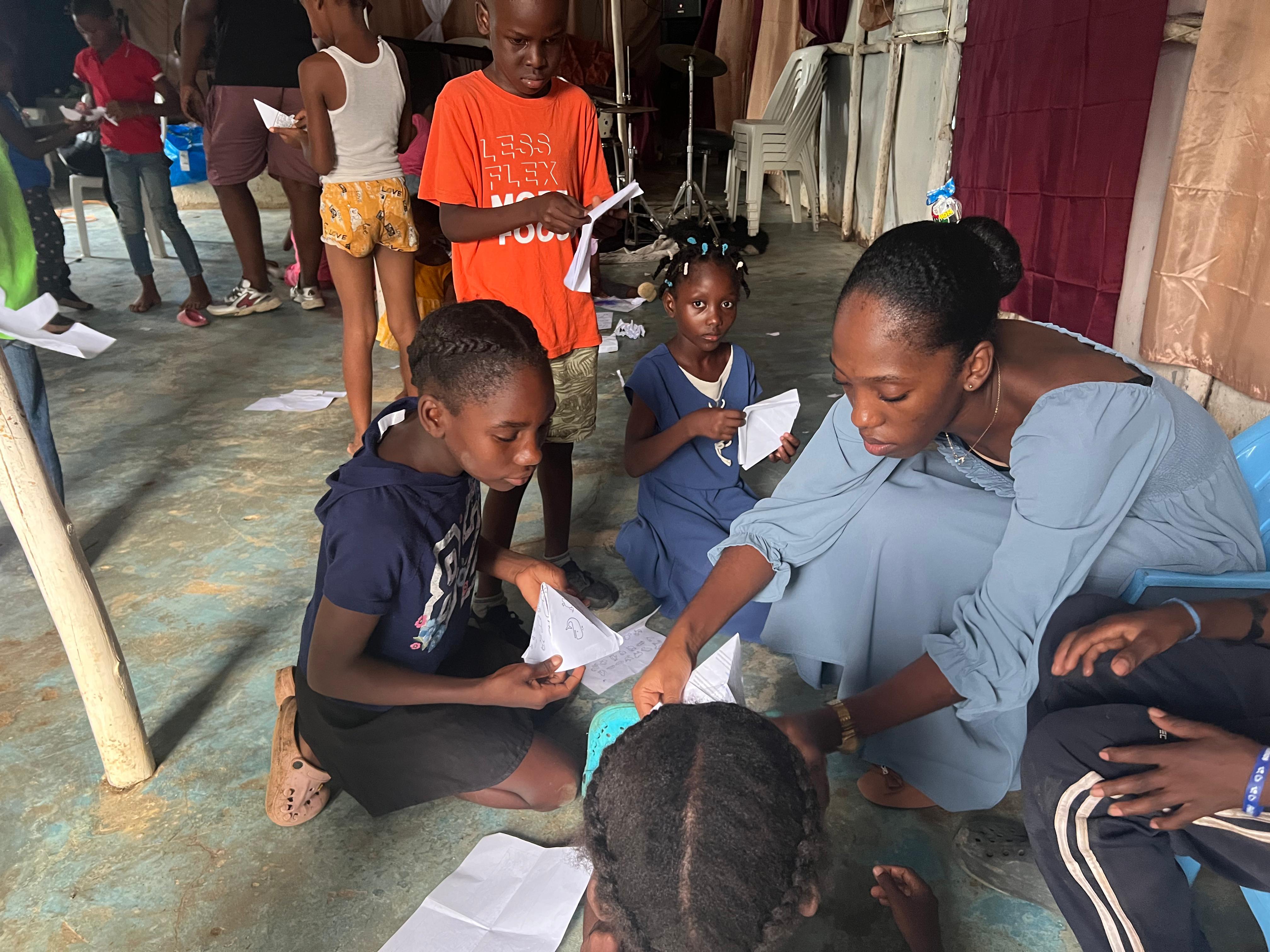 Volunteer helping children with English conversation